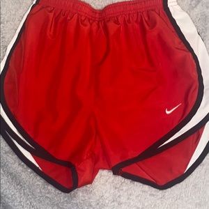 red nike shorts